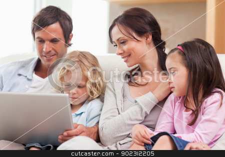 To use this stock image in your creative project, please select the size you need over to the right and click the "Add to Cart" button.
Your downloaded image will come with the Cutcaster watermark removed so don’t worry about the watermark you see on this page. Serene family using a notebook stock photo, Serene family using a notebook in a living room by Wavebreak Media
