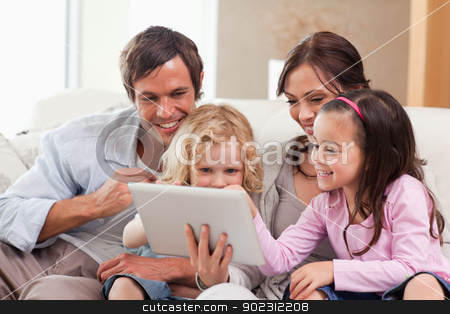 To use this stock image in your creative project, please select the size you need over to the right and click the "Add to Cart" button.
Your downloaded image will come with the Cutcaster watermark removed so don’t worry about the watermark you see on this page. Delighted family using a tablet computer stock photo, Delighted family using a tablet computer in a living room by Wavebreak Media