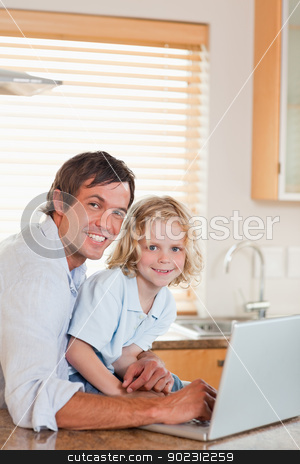 To use this stock image in your creative project, please select the size you need over to the right and click the "Add to Cart" button.
Your downloaded image will come with the Cutcaster watermark removed so don’t worry about the watermark you see on this page. Portrait of a boy and his father using a notebook together stock photo, Portrait of a boy and his father using a notebook together in a kitchen by Wavebreak Media