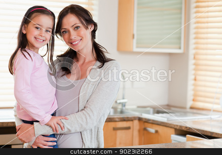 To use this stock image in your creative project, please select the size you need over to the right and click the "Add to Cart" button.
Your downloaded image will come with the Cutcaster watermark removed so don’t worry about the watermark you see on this page. Girl and her mother posing stock photo, Girl and her mother posing in a kitchen by Wavebreak Media