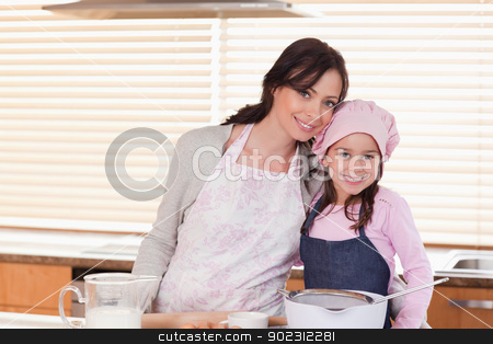 To use this stock image in your creative project, please select the size you need over to the right and click the "Add to Cart" button.
Your downloaded image will come with the Cutcaster watermark removed so don’t worry about the watermark you see on this page. Mother and daughter baking stock photo, Mother and daughter baking in a kitchen by Wavebreak Media