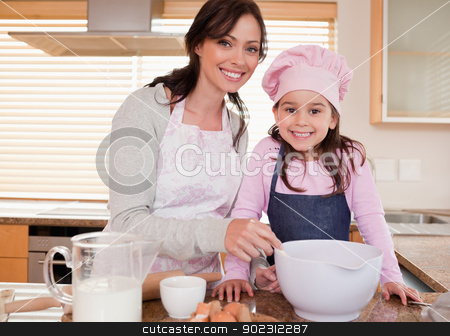 To use this stock image in your creative project, please select the size you need over to the right and click the "Add to Cart" button.
Your downloaded image will come with the Cutcaster watermark removed so don’t worry about the watermark you see on this page. Mother baking with her daughter stock photo, Mother baking with her daughter in a kitchen by Wavebreak Media