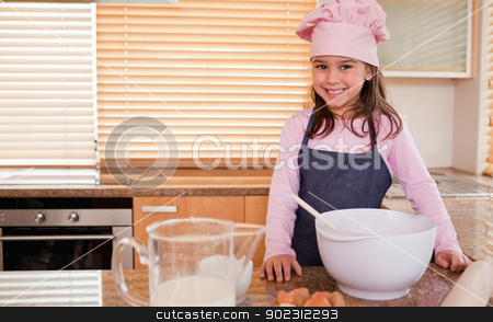 To use this stock image in your creative project, please select the size you need over to the right and click the "Add to Cart" button.
Your downloaded image will come with the Cutcaster watermark removed so don’t worry about the watermark you see on this page. Little girl baking stock photo, Little girl baking in a kitchen by Wavebreak Media