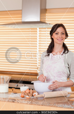 To use this stock image in your creative project, please select the size you need over to the right and click the "Add to Cart" button.
Your downloaded image will come with the Cutcaster watermark removed so don’t worry about the watermark you see on this page. Portrait of a beautiful woman baking stock photo, Portrait of a beautiful woman baking in her kitchen by Wavebreak Media