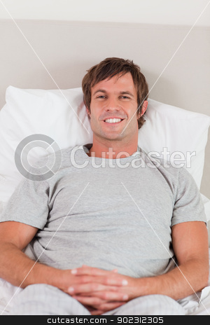 To use this stock image in your creative project, please select the size you need over to the right and click the "Add to Cart" button.
Your downloaded image will come with the Cutcaster watermark removed so don’t worry about the watermark you see on this page. Portrait of a man lying on his bed stock photo, Portrait of a man lying on his bed while looking at the camera by Wavebreak Media