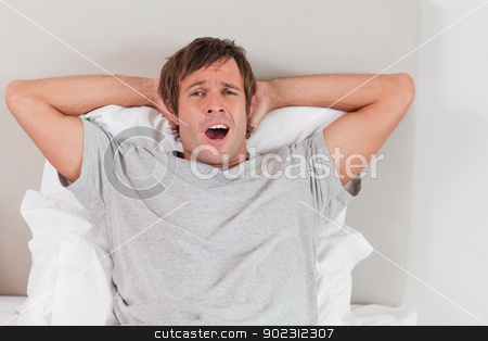 To use this stock image in your creative project, please select the size you need over to the right and click the "Add to Cart" button.
Your downloaded image will come with the Cutcaster watermark removed so don’t worry about the watermark you see on this page. Handsome man yawning stock photo, Handsome man yawning in his bedroom by Wavebreak Media