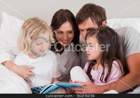 To use this stock image in your creative project, please select the size you need over to the right and click the "Add to Cart" button.
Your downloaded image will come with the Cutcaster watermark removed so don’t worry about the watermark you see on this page. Family reading a book stock photo, Family reading a book in a bedroom by Wavebreak Media