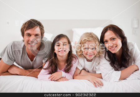 To use this stock image in your creative project, please select the size you need over to the right and click the "Add to Cart" button.
Your downloaded image will come with the Cutcaster watermark removed so don’t worry about the watermark you see on this page. Cheerful family lying in a bed stock photo, Cheerful family lying in a bed together by Wavebreak Media