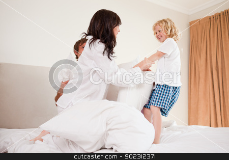 To use this stock image in your creative project, please select the size you need over to the right and click the "Add to Cart" button.
Your downloaded image will come with the Cutcaster watermark removed so don’t worry about the watermark you see on this page. Playful family having pillow fight stock photo, Playful family having pillow fight in a bedroom by Wavebreak Media