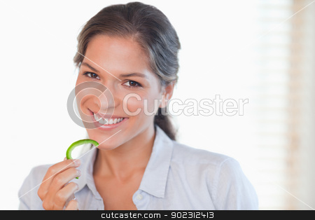To use this stock image in your creative project, please select the size you need over to the right and click the "Add to Cart" button.
Your downloaded image will come with the Cutcaster watermark removed so don’t worry about the watermark you see on this page. Smiling woman eating a slice of pepper stock photo, Smiling woman eating a slice of pepper in her kitchen by Wavebreak Media