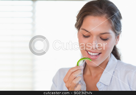 To use this stock image in your creative project, please select the size you need over to the right and click the "Add to Cart" button.
Your downloaded image will come with the Cutcaster watermark removed so don’t worry about the watermark you see on this page. Happy woman eating a slice of pepper stock photo, Happy woman eating a slice of pepper in her kitchen by Wavebreak Media