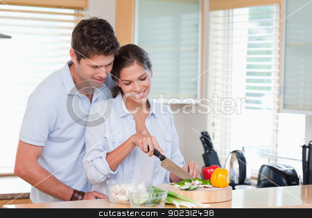 To use this stock image in your creative project, please select the size you need over to the right and click the "Add to Cart" button.
Your downloaded image will come with the Cutcaster watermark removed so don’t worry about the watermark you see on this page. Happy couple cooking stock photo, Happy couple cooking in their kitchen by Wavebreak Media