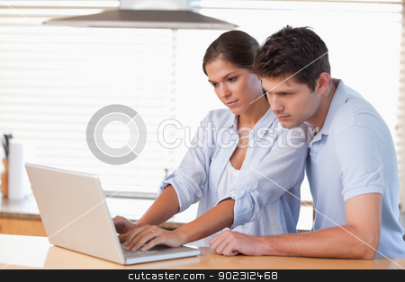 To use this stock image in your creative project, please select the size you need over to the right and click the "Add to Cart" button.
Your downloaded image will come with the Cutcaster watermark removed so don’t worry about the watermark you see on this page. Couple using a notebook stock photo, Couple using a notebook in their kitchen by Wavebreak Media