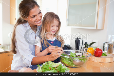 To use this stock image in your creative project, please select the size you need over to the right and click the "Add to Cart" button.
Your downloaded image will come with the Cutcaster watermark removed so don’t worry about the watermark you see on this page. Mother and her daughter preparing a salad stock photo, Mother and her daughter preparing a salad in their kitchen by Wavebreak Media