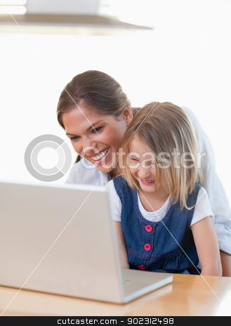 To use this stock image in your creative project, please select the size you need over to the right and click the "Add to Cart" button.
Your downloaded image will come with the Cutcaster watermark removed so don’t worry about the watermark you see on this page. Portrait of a mother and her daughter using a notebook stock photo, Portrait of a mother and her daughter using a notebook in their kitchen by Wavebreak Media