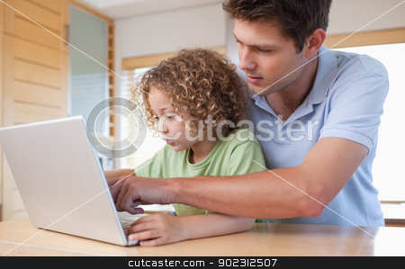 To use this stock image in your creative project, please select the size you need over to the right and click the "Add to Cart" button.
Your downloaded image will come with the Cutcaster watermark removed so don’t worry about the watermark you see on this page. Boy and his father using a laptop stock photo, Boy and his father using a laptop in a kitchen by Wavebreak Media