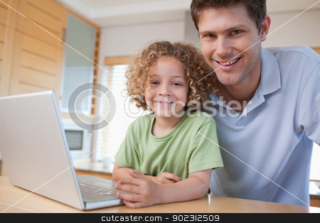 To use this stock image in your creative project, please select the size you need over to the right and click the "Add to Cart" button.
Your downloaded image will come with the Cutcaster watermark removed so don’t worry about the watermark you see on this page. Happy boy and his father using a notebook stock photo, Happy boy and his father using a notebook in their kitchen by Wavebreak Media