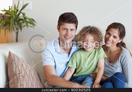 To use this stock image in your creative project, please select the size you need over to the right and click the "Add to Cart" button.
Your downloaded image will come with the Cutcaster watermark removed so don’t worry about the watermark you see on this page. Family sitting on a sofa stock photo, Family sitting on a sofa while looking at the camera by Wavebreak Media