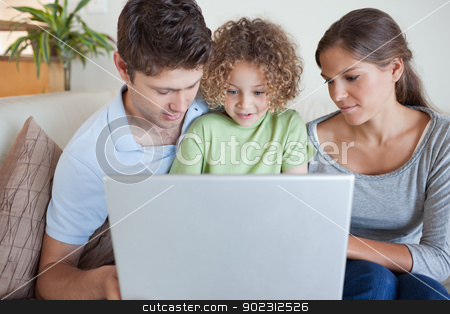 To use this stock image in your creative project, please select the size you need over to the right and click the "Add to Cart" button.
Your downloaded image will come with the Cutcaster watermark removed so don’t worry about the watermark you see on this page. Family using a laptop stock photo, Family using a laptop while sitting on a sofa by Wavebreak Media
