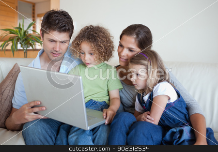 To use this stock image in your creative project, please select the size you need over to the right and click the "Add to Cart" button.
Your downloaded image will come with the Cutcaster watermark removed so don’t worry about the watermark you see on this page. Serene family using a notebook stock photo, Serene family using a notebook in their living room by Wavebreak Media