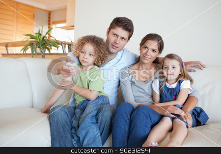 To use this stock image in your creative project, please select the size you need over to the right and click the "Add to Cart" button.
Your downloaded image will come with the Cutcaster watermark removed so don’t worry about the watermark you see on this page. Family watching TV together stock photo, Family watching TV together in their living room by Wavebreak Media