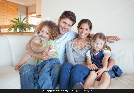To use this stock image in your creative project, please select the size you need over to the right and click the "Add to Cart" button.
Your downloaded image will come with the Cutcaster watermark removed so don’t worry about the watermark you see on this page. Happy family watching TV together stock photo, Happy family watching TV together in their living room by Wavebreak Media
