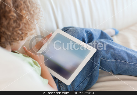 To use this stock image in your creative project, please select the size you need over to the right and click the "Add to Cart" button.
Your downloaded image will come with the Cutcaster watermark removed so don’t worry about the watermark you see on this page. Back view boy using a tablet computer stock photo, Back view boy using a tablet computer in a living room by Wavebreak Media