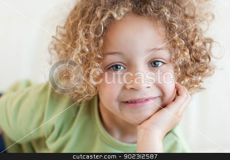 To use this stock image in your creative project, please select the size you need over to the right and click the "Add to Cart" button.
Your downloaded image will come with the Cutcaster watermark removed so don’t worry about the watermark you see on this page. Close up of a cute boy lying on a sofa stock photo, Close up of a cute boy lying on a sofa while looking at the camera by Wavebreak Media