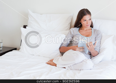 To use this stock image in your creative project, please select the size you need over to the right and click the "Add to Cart" button.
Your downloaded image will come with the Cutcaster watermark removed so don’t worry about the watermark you see on this page. Woman holding a book stock photo, Woman holding a book in her bedroom by Wavebreak Media