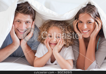 To use this stock image in your creative project, please select the size you need over to the right and click the "Add to Cart" button.
Your downloaded image will come with the Cutcaster watermark removed so don’t worry about the watermark you see on this page. Family posing under a duvet stock photo, Family posing under a duvet while looking at the camera by Wavebreak Media
