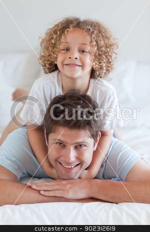 To use this stock image in your creative project, please select the size you need over to the right and click the "Add to Cart" button.
Your downloaded image will come with the Cutcaster watermark removed so don’t worry about the watermark you see on this page. Smiling father and child lying on bed stock photo, Smiling father and child lying on bed together by Wavebreak Media