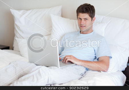 To use this stock image in your creative project, please select the size you need over to the right and click the "Add to Cart" button.
Your downloaded image will come with the Cutcaster watermark removed so don’t worry about the watermark you see on this page. Man lying in bed with notebook stock photo, Man lying in bed with his notebook by Wavebreak Media