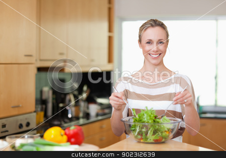 To use this stock image in your creative project, please select the size you need over to the right and click the "Add to Cart" button.
Your downloaded image will come with the Cutcaster watermark removed so don’t worry about the watermark you see on this page. Woman preparing healthy salad stock photo, Smiling woman preparing healthy salad by Wavebreak Media