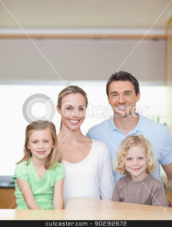 To use this stock image in your creative project, please select the size you need over to the right and click the "Add to Cart" button.
Your downloaded image will come with the Cutcaster watermark removed so don’t worry about the watermark you see on this page. Cheerful family standing in the kitchen together stock photo, Cheerful smiling family standing in the kitchen together by Wavebreak Media