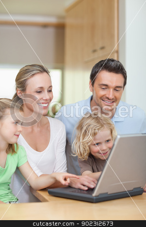 To use this stock image in your creative project, please select the size you need over to the right and click the "Add to Cart" button.
Your downloaded image will come with the Cutcaster watermark removed so don’t worry about the watermark you see on this page. Family using laptop in the kitchen stock photo, Family using laptop in the kitchen together by Wavebreak Media