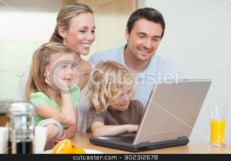 To use this stock image in your creative project, please select the size you need over to the right and click the "Add to Cart" button.
Your downloaded image will come with the Cutcaster watermark removed so don’t worry about the watermark you see on this page. Family using the internet in the kitchen stock photo, Family using the internet in the kitchen together by Wavebreak Media