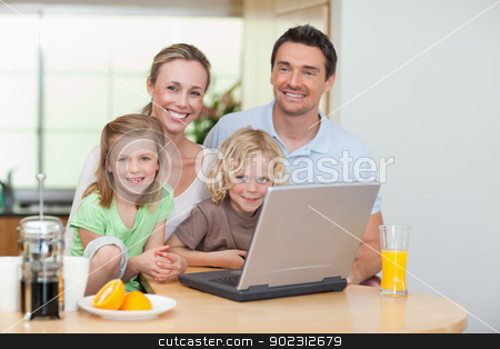 To use this stock image in your creative project, please select the size you need over to the right and click the "Add to Cart" button.
Your downloaded image will come with the Cutcaster watermark removed so don’t worry about the watermark you see on this page. Smiling family using the internet in the kitchen stock photo, Smiling family using the internet together in the kitchen by Wavebreak Media