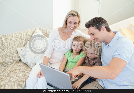 To use this stock image in your creative project, please select the size you need over to the right and click the "Add to Cart" button.
Your downloaded image will come with the Cutcaster watermark removed so don’t worry about the watermark you see on this page. Family on the couch with laptop stock photo, Family together on the couch with laptop by Wavebreak Media