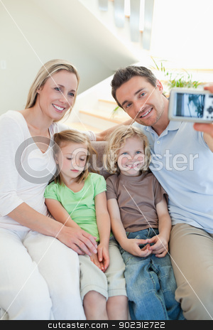 To use this stock image in your creative project, please select the size you need over to the right and click the "Add to Cart" button.
Your downloaded image will come with the Cutcaster watermark removed so don’t worry about the watermark you see on this page. Man taking family picture on couch stock photo, Man taking family picture on the couch by Wavebreak Media