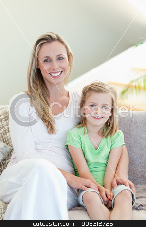 To use this stock image in your creative project, please select the size you need over to the right and click the "Add to Cart" button.
Your downloaded image will come with the Cutcaster watermark removed so don’t worry about the watermark you see on this page. Mother and daughter sitting on sofa together stock photo, Mother and daughter sitting on the sofa together by Wavebreak Media