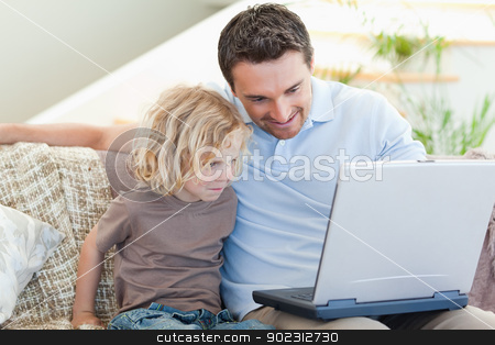 To use this stock image in your creative project, please select the size you need over to the right and click the "Add to Cart" button.
Your downloaded image will come with the Cutcaster watermark removed so don’t worry about the watermark you see on this page. Father and son with laptop on the sofa stock photo, Father and son together with laptop on the sofa by Wavebreak Media