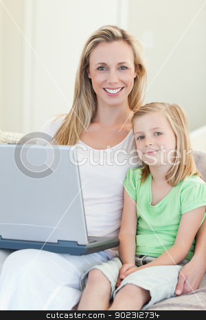 To use this stock image in your creative project, please select the size you need over to the right and click the "Add to Cart" button.
Your downloaded image will come with the Cutcaster watermark removed so don’t worry about the watermark you see on this page. Mother and daughter with laptop on sofa stock photo, Mother and daughter together with laptop on sofa by Wavebreak Media