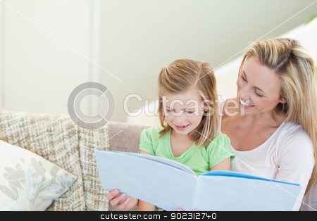 To use this stock image in your creative project, please select the size you need over to the right and click the "Add to Cart" button.
Your downloaded image will come with the Cutcaster watermark removed so don’t worry about the watermark you see on this page. Mother and daughter reading a magazine stock photo, Mother and daughter reading a magazine together by Wavebreak Media
