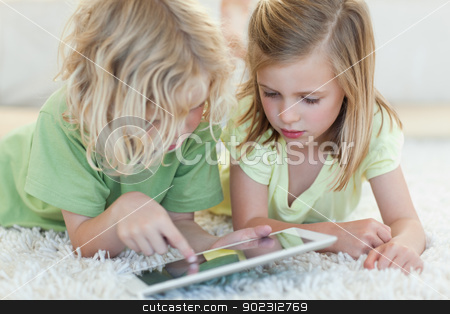 To use this stock image in your creative project, please select the size you need over to the right and click the "Add to Cart" button.
Your downloaded image will come with the Cutcaster watermark removed so don’t worry about the watermark you see on this page. Siblings on the floor using tablet stock photo, Siblings together on the floor using tablet by Wavebreak Media
