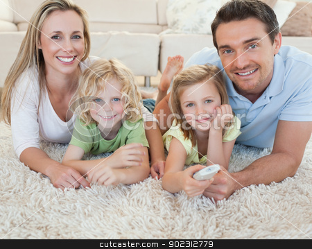 To use this stock image in your creative project, please select the size you need over to the right and click the "Add to Cart" button.
Your downloaded image will come with the Cutcaster watermark removed so don’t worry about the watermark you see on this page. Family watching tv on the floor stock photo, Family watching tv together on the floor by Wavebreak Media