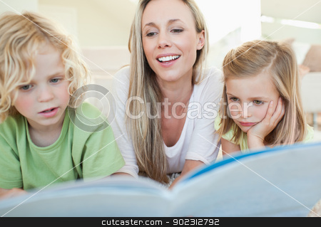 To use this stock image in your creative project, please select the size you need over to the right and click the "Add to Cart" button.
Your downloaded image will come with the Cutcaster watermark removed so don’t worry about the watermark you see on this page. Mother reading magazine with her children stock photo, Mother reading magazine together with her children by Wavebreak Media