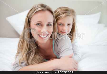 To use this stock image in your creative project, please select the size you need over to the right and click the "Add to Cart" button.
Your downloaded image will come with the Cutcaster watermark removed so don’t worry about the watermark you see on this page. Girl lying on her mothers back stock photo, Little girl lying on her mothers back by Wavebreak Media
