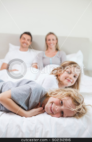 To use this stock image in your creative project, please select the size you need over to the right and click the "Add to Cart" button.
Your downloaded image will come with the Cutcaster watermark removed so don’t worry about the watermark you see on this page. Family taking a rest on the bed stock photo, Family taking a rest together on the bed by Wavebreak Media