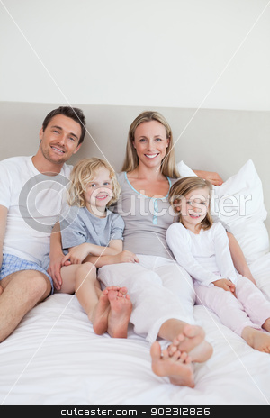 To use this stock image in your creative project, please select the size you need over to the right and click the "Add to Cart" button.
Your downloaded image will come with the Cutcaster watermark removed so don’t worry about the watermark you see on this page. Happy family sitting on the bed stock photo, Happy family sitting on the bed together by Wavebreak Media