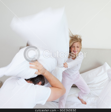 To use this stock image in your creative project, please select the size you need over to the right and click the "Add to Cart" button.
Your downloaded image will come with the Cutcaster watermark removed so don’t worry about the watermark you see on this page. Girl hitting her father with pillow stock photo, Little girl hitting her father with pillow by Wavebreak Media